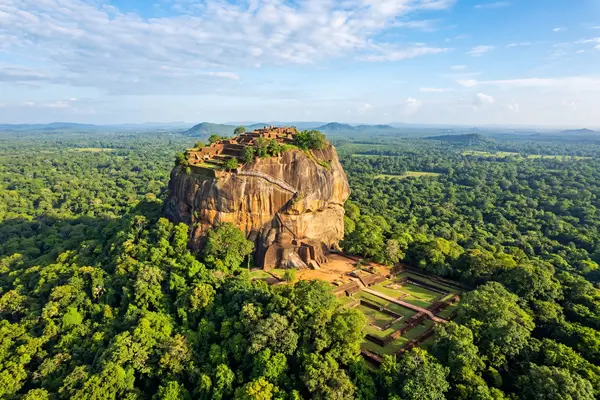 Sigiriya Rock Fortress rising from the jungle canopy in Sri Lanka