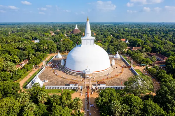 Aerial view of Ruwanwelisaya dagoba in Anuradhapura surrounded by tropical trees