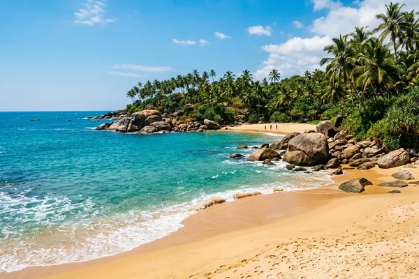 Secluded Tangalle bay with boulders and golden sand